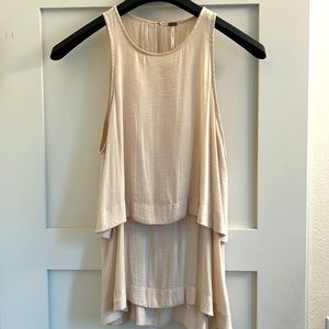 Tiered Free People blouse with peephole neck; very lightly used; cream color; XS